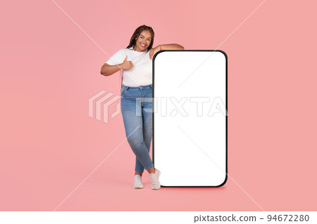 African Woman Leaning On Cellphone Screen Gesturing Like, Pink Background African Woman Leaning On Cellphone Screen Gesturing Like, Pink Background 94672280
