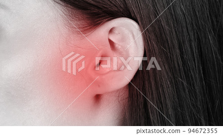 Tinnitus. Profile of sick woman having ear pain, monochrome photo with red spot, closeup shot, panorama 94672355