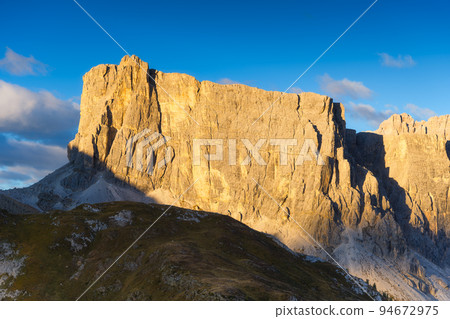 Dolomite Alps, Italy. View of the mountains and high cliffs during sunset. High sharp rocks 94672975