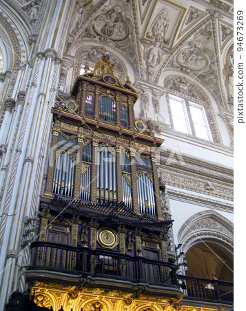 Antique organ in church in Cordoba. Mezquita Catedral de Cordoba. Roman Catholic Cathedral. Spain Antique organ in church in Cordoba. Mezquita Catedral de Cordoba. Roman Catholic Cathedral. Spain 94673269