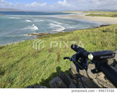 Concept of enjoying the outdoors by bicycle and boat at Gweebarra Bay , County Donegal - Ireland 94673588