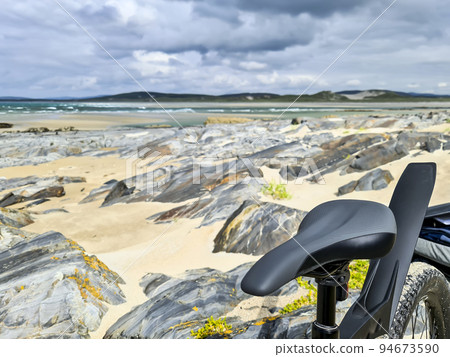 Concept of enjoying the outdoors by bicycle and boat at Gweebarra Bay , County Donegal - Ireland Concept of enjoying the outdoors by bicycle and boat at Gweebarra Bay , County Donegal - Ireland 94673590