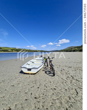 Concept of enjoying the outdoors by bicycle and boat at Gweebarra Bay , County Donegal - Ireland Concept of enjoying the outdoors by bicycle and boat at Gweebarra Bay , County Donegal - Ireland 94673593