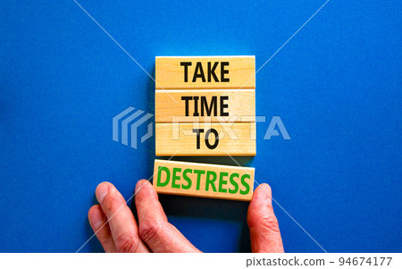 Take time to destress symbol. Concept words Take time to destress on wooden blocks. Beautiful blue table blue background. Psychological business and take time to destress concept. Copy space. 94674177
