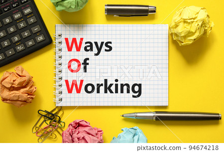 WOW ways of working symbol. Concept words WOW ways of working on white note on a beautiful yellow background. Black calculator and pen. Business and WOW ways of working concept. Copy space. WOW ways of working symbol. Concept words WOW ways of working on white note on a beautiful yellow background. Black calculator and pen. Business and WOW ways of working concept. Copy space. 94674218