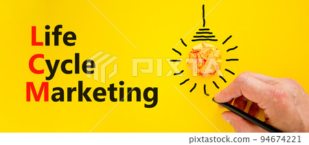 LCM lifecycle marketing symbol. Concept words LCM lifecycle marketing on a beautiful yellow background. Orange light bulb icon. Businessman hand. Business LCM lifecycle marketing concept. Copy space. LCM lifecycle marketing symbol. Concept words LCM lifecycle marketing on a beautiful yellow background. Orange light bulb icon. Businessman hand. Business LCM lifecycle marketing concept. Copy space. 94674221