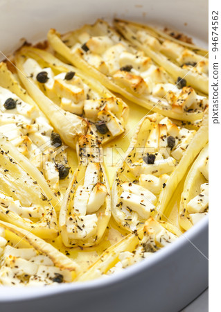 baked white peppers with Feta cheese baked white peppers with Feta cheese 94674562