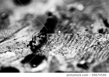 Selective focus on spiral metal shavings left over from drilling metal 94674580