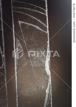 Strip of tape adhesive on a glass surface after being pulled. Strip of tape adhesive on a glass surface after being pulled. 94674678