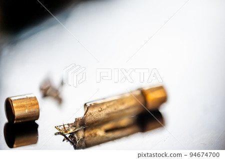 Brown damaged fuse that has blown and defective. 94674700