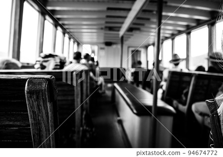 focus on wooden bench on a tour boat in Glacier National Park, Montana, USA 94674772