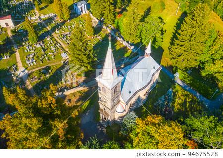 Rural catholic church from above 94675528