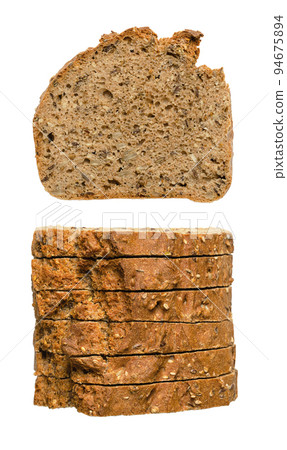 Spelt bread slices, front and top view, isolated on white background. Homemade and crusty baked, fresh dark bread, made of wholemeal spelt, bread spices, sunflower and flax seeds. Close-up food photo. Spelt bread slices, front and top view, isolated on white background. Homemade and crusty baked, fresh dark bread, made of wholemeal spelt, bread spices, sunflower and flax seeds. Close-up food photo. 94675894