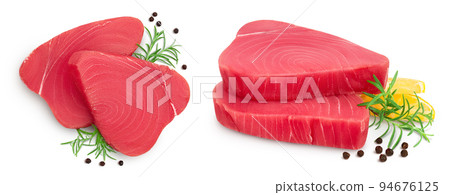 Fresh tuna fish fillet steak with rosemary and peppercorns isolated on white background. Top view. Flat lay 94676125