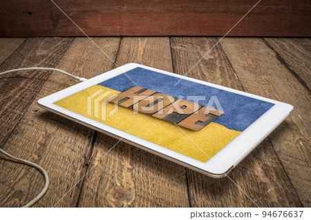 hope word in vintage wood type against Ukraine colors 94676637