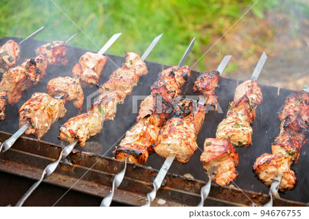 Cooking shish kebab on the grill. Cooking 94676755
