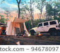 Campsite tent, car and sunset 94678097