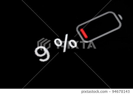 Smartphone charged battery level indicator - nine, 9 percent: close up macro 94678143