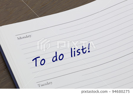 To do list diary reminder open on desk 94680275
