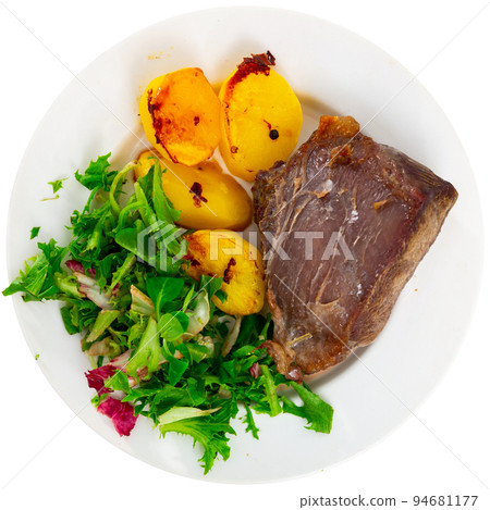 Tasty homemade grilled beef tenderloin steak, fried potato and salad with arugula 94681177