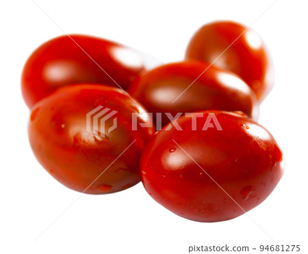 Closeup of ripe red cherry tomatoes. Sliced cherry tomato 94681275