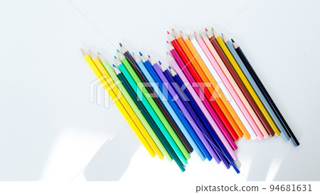 Colored pencil crayons in a row 94681631
