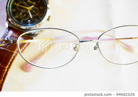 glasses and watch on white table glasses and watch on white table 94682026