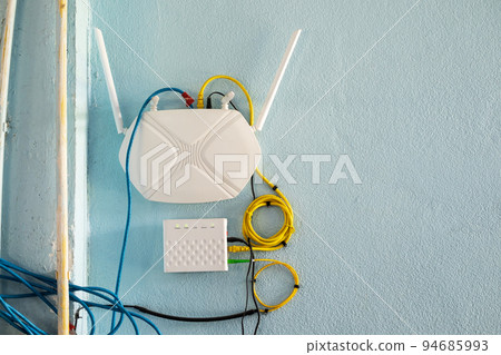 Internet and Intranet Modem Router with Wireless Transmission Set Up and Working on the Wall Internet and Intranet Modem Router with Wireless Transmission Set Up and Working on the Wall 94685993