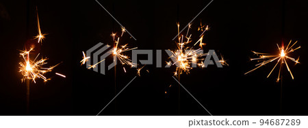Set of sparkler with sparks with lens glare on black background for overlay blending mode for holiday design projects Set of sparkler with sparks with lens glare on black background for overlay blending mode for holiday design projects 94687289