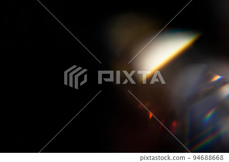 colorful rainbow crystal light leaks on black background 94688668