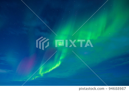 Aurora Borealis in Iceland. Northern Lights over the mountains. Iceland 94688987