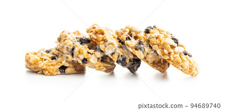 Wholegrain oat cookies. Cookies with oatmeal and raisins isolated on white table. Wholegrain oat cookies. Cookies with oatmeal and raisins isolated on white table. 94689740