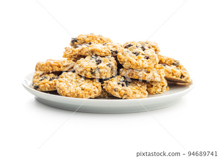 Wholegrain oat cookies. Cookies with oatmeal and raisins isolated on white table. Wholegrain oat cookies. Cookies with oatmeal and raisins isolated on white table. 94689741
