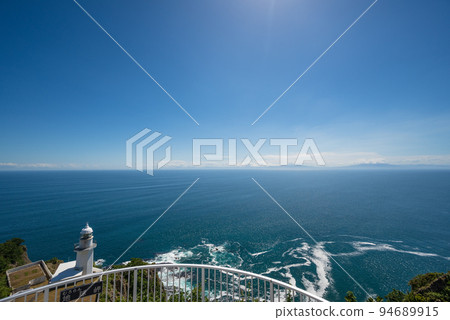 Cape Chikyu on a cliff surrounded by blue 94689915