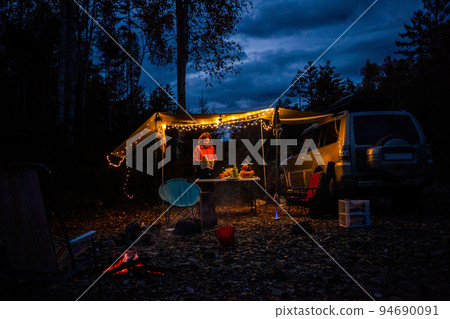 Car camping in autumn forest near the river. Evening. 94690091