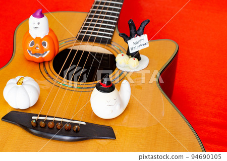 Acoustic guitar and Halloween toys Acoustic guitar and Halloween toys 94690105