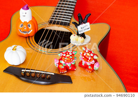 Acoustic guitar and Halloween toys Acoustic guitar and Halloween toys 94690110