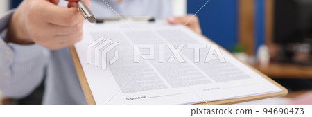 Businesswoman give silver pen to client to put signature on contract paper 94690473