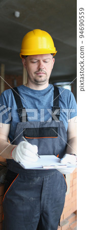Busy professional worker hold clipboard and list needed work materials 94690559