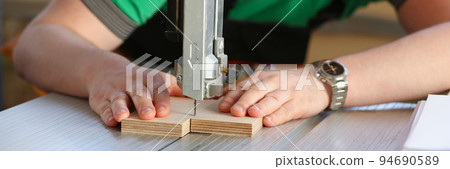 Worker using electric saw, handyman on workplace, diy 94690589