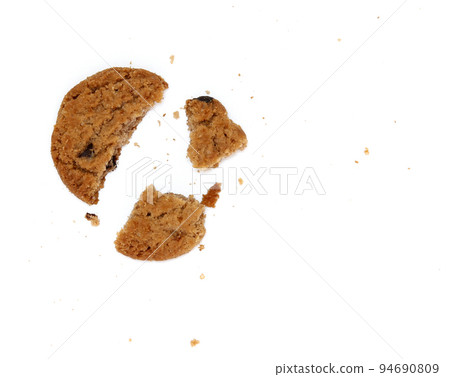 round chocolate chip cookie with crumbs isolated on white background round chocolate chip cookie with crumbs isolated on white background 94690809