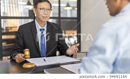 Attorney or judge provides legal advice to the client in the courtroom, Ethics in the courts include justice and impartiality, Legal consultant, Scales of justice, Law hammer, Litigation and justice. 94691184