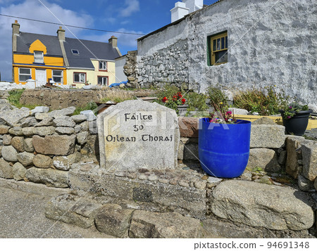 Writing on stone welcoming visitors in irish to Tory Island, County Donegal, Republic of Ireland - Translation: Welcome to Tory Island Writing on stone welcoming visitors in irish to Tory Island, County Donegal, Republic of Ireland - Translation: Welcome to Tory Island 94691348