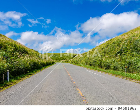 Driving scenery of Aso Milk Road with blue sky (Aso City, Kumamoto Prefecture) Driving scenery of Aso Milk Road with blue sky (Aso City, Kumamoto Prefecture) 94691962
