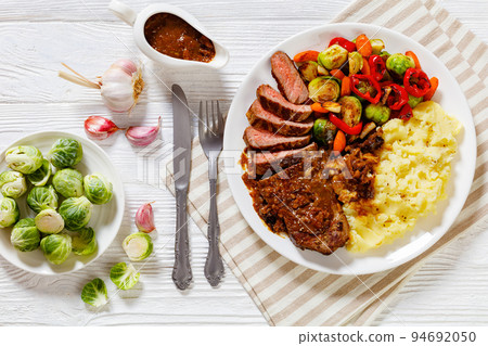beef steak with potato mash and roasted vegetables beef steak with potato mash and roasted vegetables 94692050