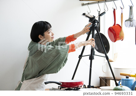 Young woman preparing for cooking livestream 94693331