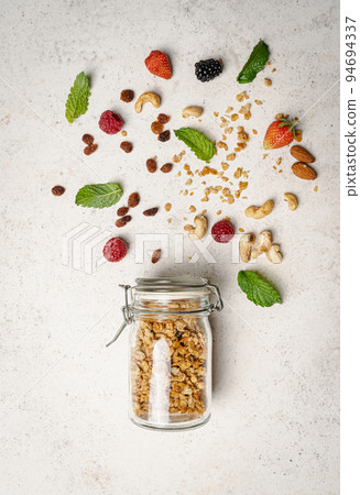 glass jar of homemade granola 94694337