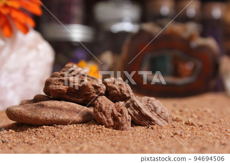 Desert Rose Rocks From Oklahoma on Red Sand. Meditation Table Close up Desert Rose Rocks From Oklahoma on Red Sand. Meditation Table Close up 94694506
