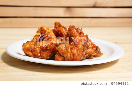 Fried Pork Skins With Red Salsa in Rustic Kitchen 94694511