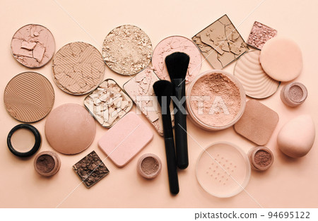 Varieties of face powders and foundations for perfect complexion, basic make up products to even out and matte skin, beauty cosmetics with brushes and sponges, selective focus, toned image 94695122